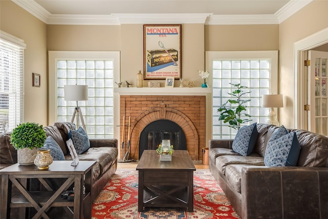 442 4th Ave E, Kalispell, MT 59901 - living room with light wood-style floors, ornamental molding, a chandelier, a brick fireplace, and a ceiling fan