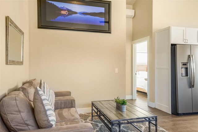 442 4th Ave E, Kalispell, MT 59901 - living room with wood finished floors, baseboards, and lofted ceiling