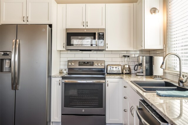 442 4th Ave E, Kalispell, MT 59901 - bedroom with dark wood-type flooring, lofted ceiling, baseboards, and a ceiling fan