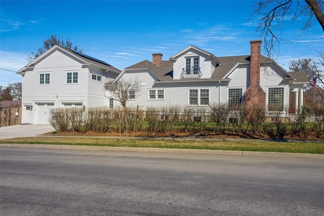 442 4th Ave E, Kalispell, MT 59901 - view of front of property featuring a chimney, a front yard, and a shingled roof