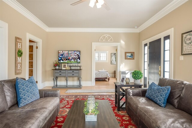 442 4th Ave E, Kalispell, MT 59901 - living room featuring light wood finished floors, ornamental molding, ceiling fan, a brick fireplace, and baseboards