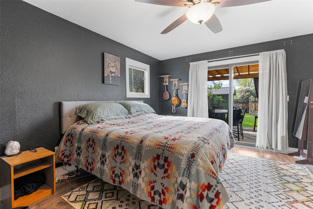2115 Burlington Ave, Missoula, MT 59801 - bedroom featuring a textured wall, wood finished floors, access to outside, and ceiling fan