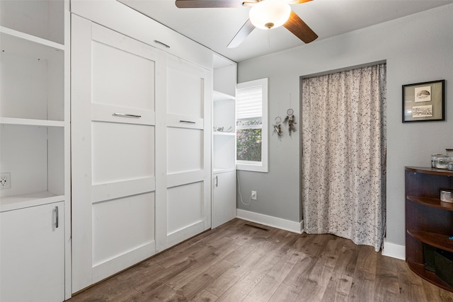 2115 Burlington Ave, Missoula, MT 59801 - unfurnished bedroom featuring wood finished floors and a ceiling fan