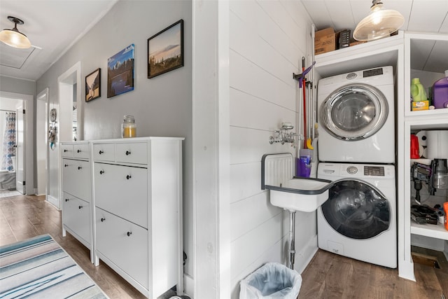 2115 Burlington Ave, Missoula, MT 59801 - laundry area with stacked washing machine and dryer and wood finished floors