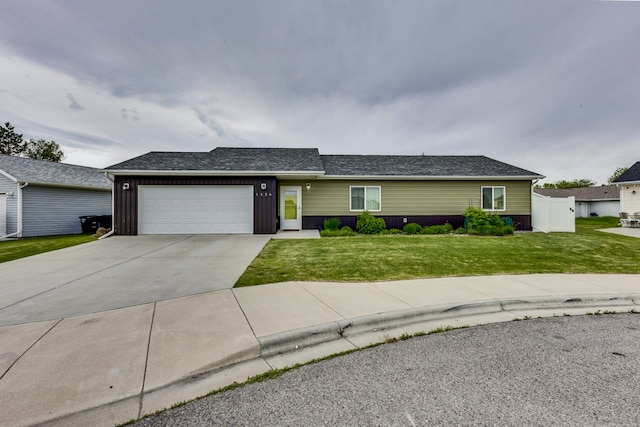 1126 Jordan Cir, Billings, MT 59105 - ranch-style home with a front yard, an attached garage, driveway, board and batten siding, and roof with shingles