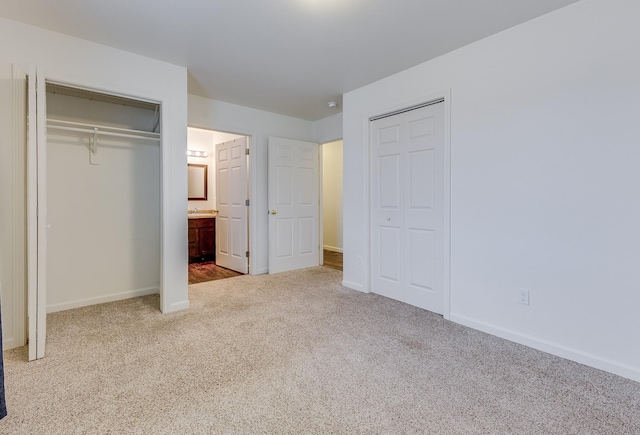 1126 Jordan Cir, Billings, MT 59105 - unfurnished bedroom with carpet, baseboards, two closets, and ensuite bathroom