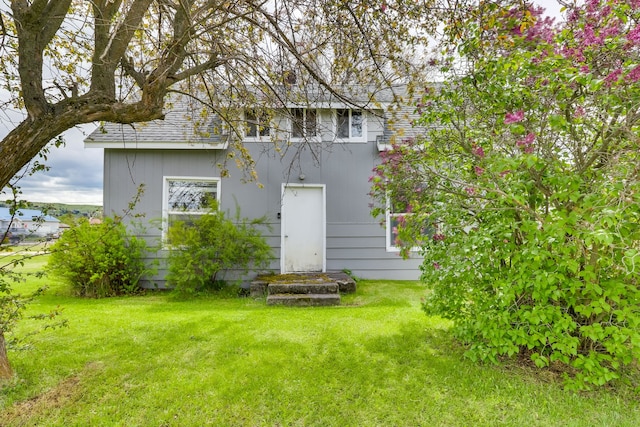 503 7th Ave W, Polson, MT 59860 - rear view of property featuring a lawn