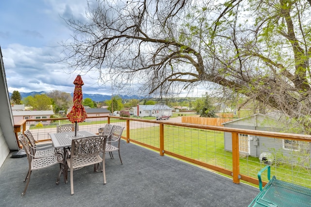 503 7th Ave W, Polson, MT 59860 - view of patio featuring outdoor dining space and a mountain view