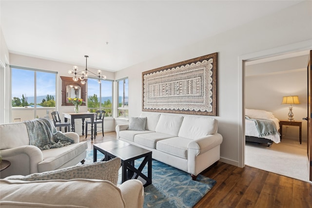 100 Woodlands Way Unit S305, Kalispell, MT 59901 - living area with a chandelier and dark wood-style flooring