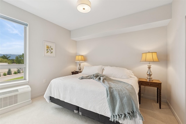 100 Woodlands Way Unit S305, Kalispell, MT 59901 - bedroom featuring light carpet, multiple windows, and a wall unit AC