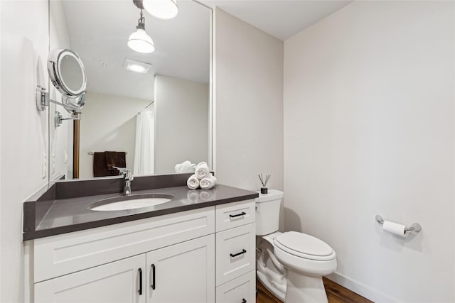 100 Woodlands Way Unit S305, Kalispell, MT 59901 - full bath featuring vanity, wood finished floors, and a shower with curtain