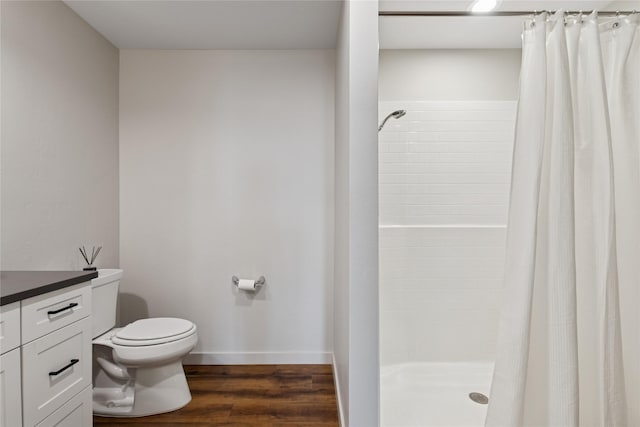 100 Woodlands Way Unit S305, Kalispell, MT 59901 - full bath featuring tiled shower, vanity, and wood finished floors