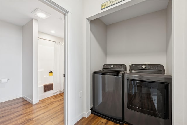 100 Woodlands Way Unit S305, Kalispell, MT 59901 - laundry area featuring separate washer and dryer, wood finished floors, and recessed lighting