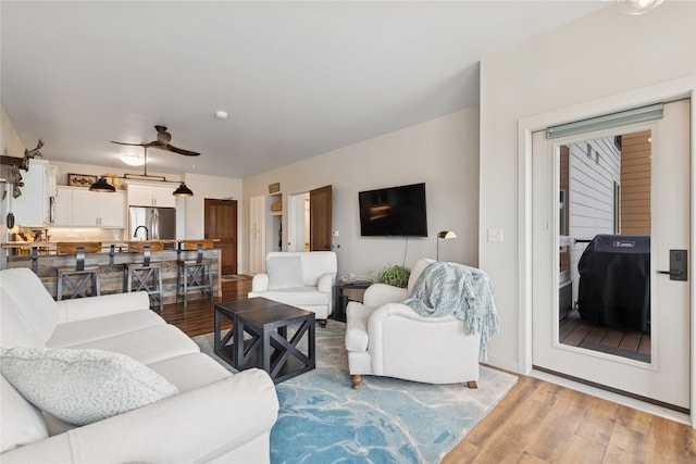 100 Woodlands Way Unit S305, Kalispell, MT 59901 - living room with light wood-style flooring and ceiling fan