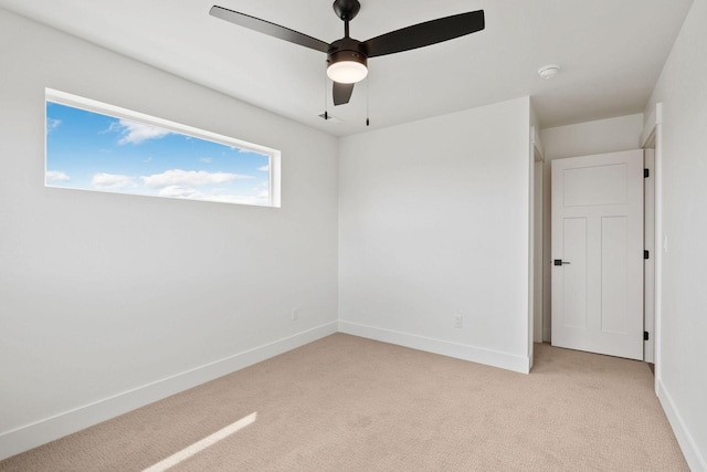 602 Holstein Way, Kalispell, MT 59901 - unfurnished room featuring light colored carpet, a ceiling fan, and a smoke detector