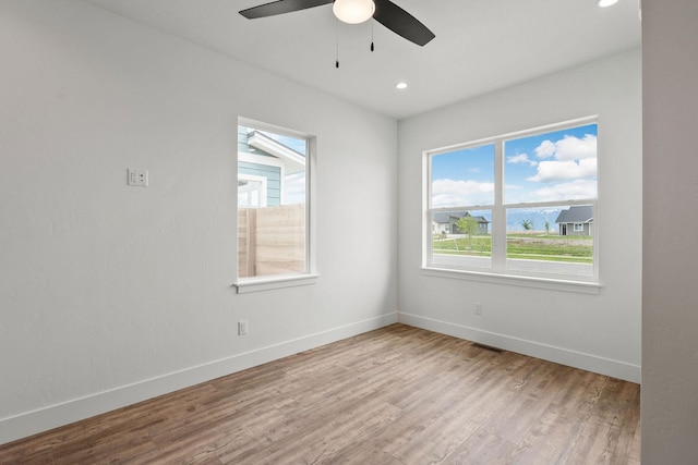 604 Holstein Way, Kalispell, MT 59901 - unfurnished room with wood finished floors, a ceiling fan, and recessed lighting