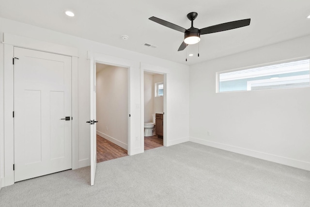 604 Holstein Way, Kalispell, MT 59901 - unfurnished bedroom featuring carpet, recessed lighting, ensuite bath, and ceiling fan