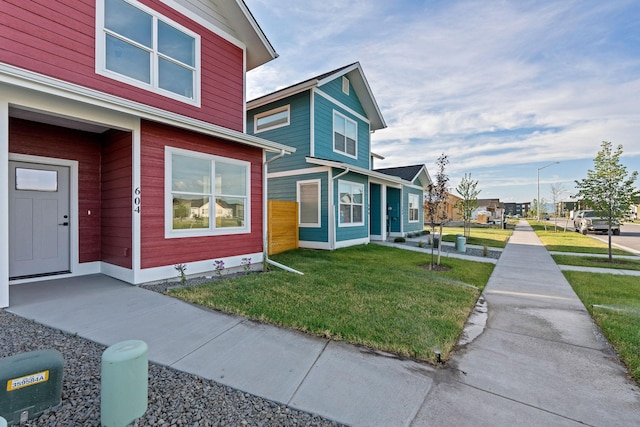 604 Holstein Way, Kalispell, MT 59901 - view of home's exterior with a lawn