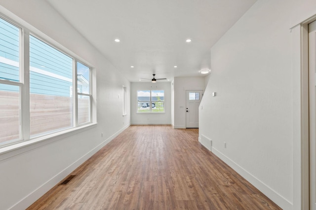 604 Holstein Way, Kalispell, MT 59901 - unfurnished living room with wood finished floors, ceiling fan, and recessed lighting