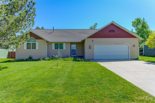 2685 Pinkerton Dr, East Helena, MT 59635 - view of front of property featuring an attached garage, driveway, and a front yard
