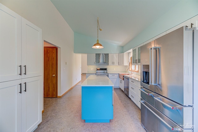2685 Pinkerton Dr, East Helena, MT 59635 - kitchen featuring appliances with stainless steel finishes, wall chimney range hood, lofted ceiling, a sink, and backsplash