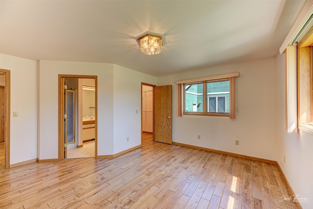 2685 Pinkerton Dr, East Helena, MT 59635 - unfurnished bedroom with light wood-style flooring, baseboards, and ensuite bath