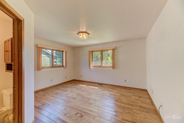2685 Pinkerton Dr, East Helena, MT 59635 - spare room featuring plenty of natural light, light wood-type flooring, and baseboards