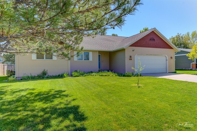 2685 Pinkerton Dr, East Helena, MT 59635 - view of front of home with an attached garage, driveway, and a front yard