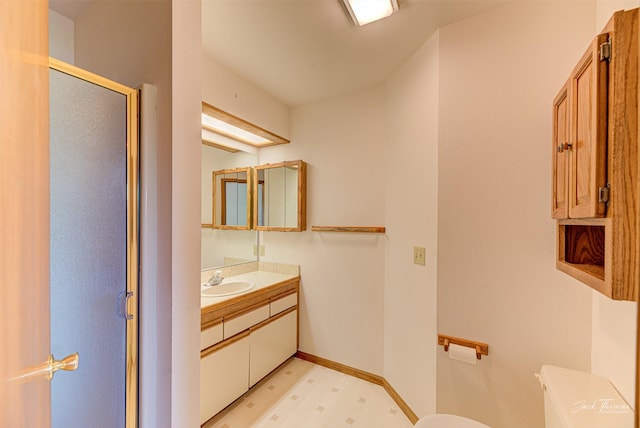 2685 Pinkerton Dr, East Helena, MT 59635 - full bath with toilet, a stall shower, vanity, baseboards, and tile patterned floors