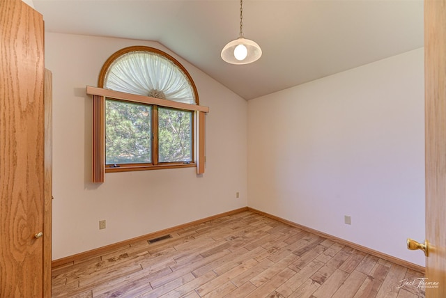 2685 Pinkerton Dr, East Helena, MT 59635 - empty room with vaulted ceiling, light wood-type flooring, and baseboards