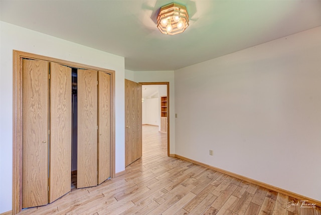 2685 Pinkerton Dr, East Helena, MT 59635 - unfurnished bedroom featuring light wood-style flooring, baseboards, and a closet