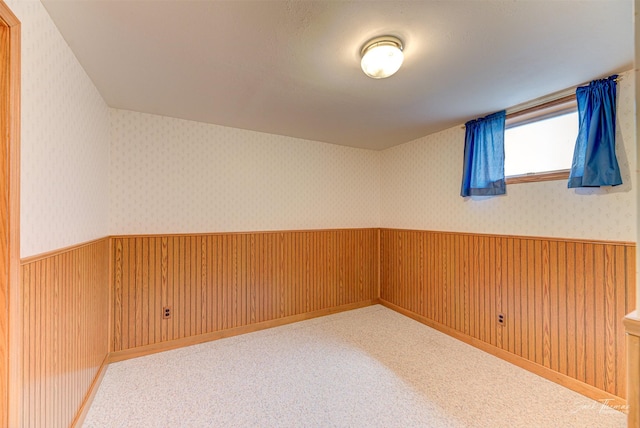 2685 Pinkerton Dr, East Helena, MT 59635 - spare room with wainscoting, wallpapered walls, and wooden walls