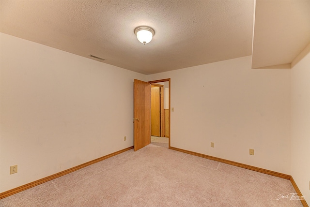 2685 Pinkerton Dr, East Helena, MT 59635 - unfurnished room featuring a textured ceiling, light carpet, and baseboards