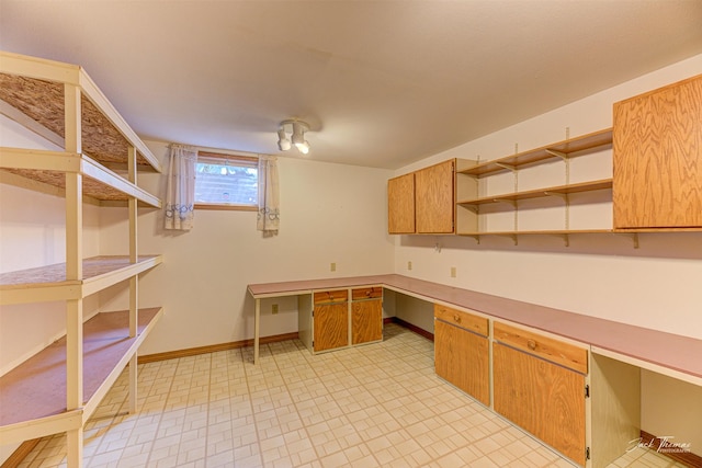 2685 Pinkerton Dr, East Helena, MT 59635 - unfurnished office featuring built in desk and baseboards