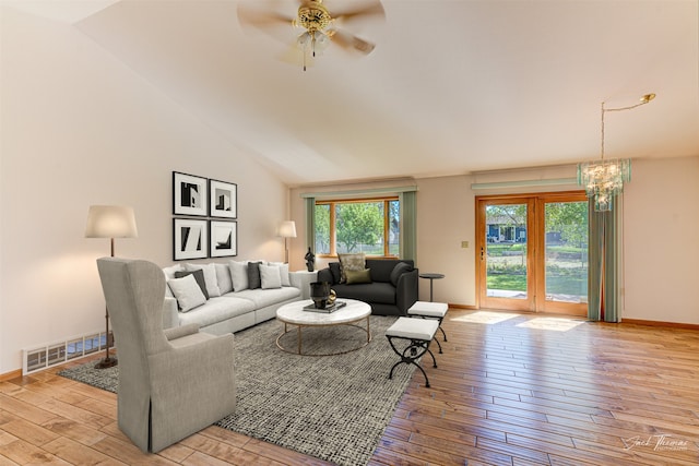 2685 Pinkerton Dr, East Helena, MT 59635 - living room featuring hardwood / wood-style flooring, a chandelier, a ceiling fan, baseboards, and vaulted ceiling