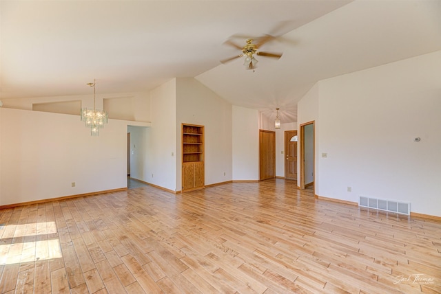 2685 Pinkerton Dr, East Helena, MT 59635 - empty room featuring a ceiling fan, a chandelier, light wood-type flooring, built in features, and high vaulted ceiling