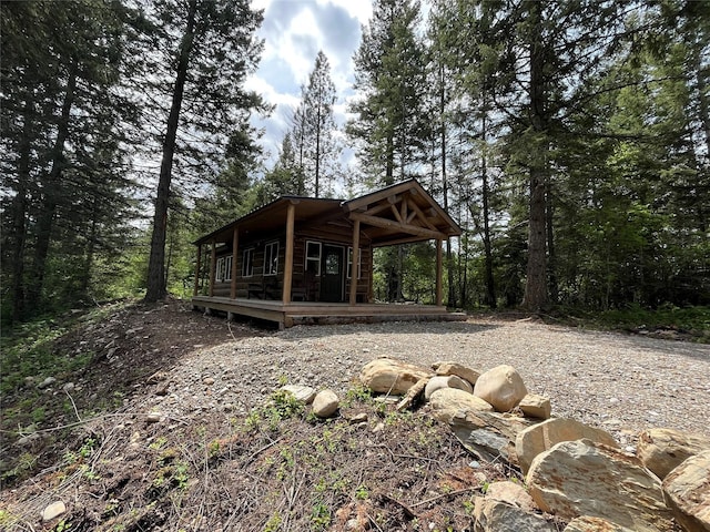 367 Lower River Rd, Heron, MT 59844 - rear view of property featuring a wooden deck and a forest view