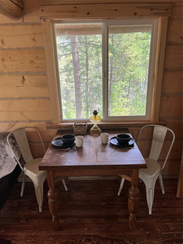 367 Lower River Rd, Heron, MT 59844 - dining area with wood walls, plenty of natural light, and wood finished floors