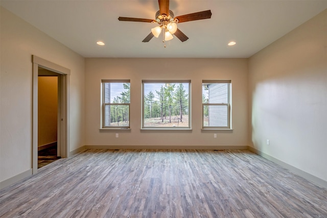 3525 Overland Rd, Helena, MT 59602 - spare room with plenty of natural light, wood finished floors, ceiling fan, recessed lighting, and baseboards