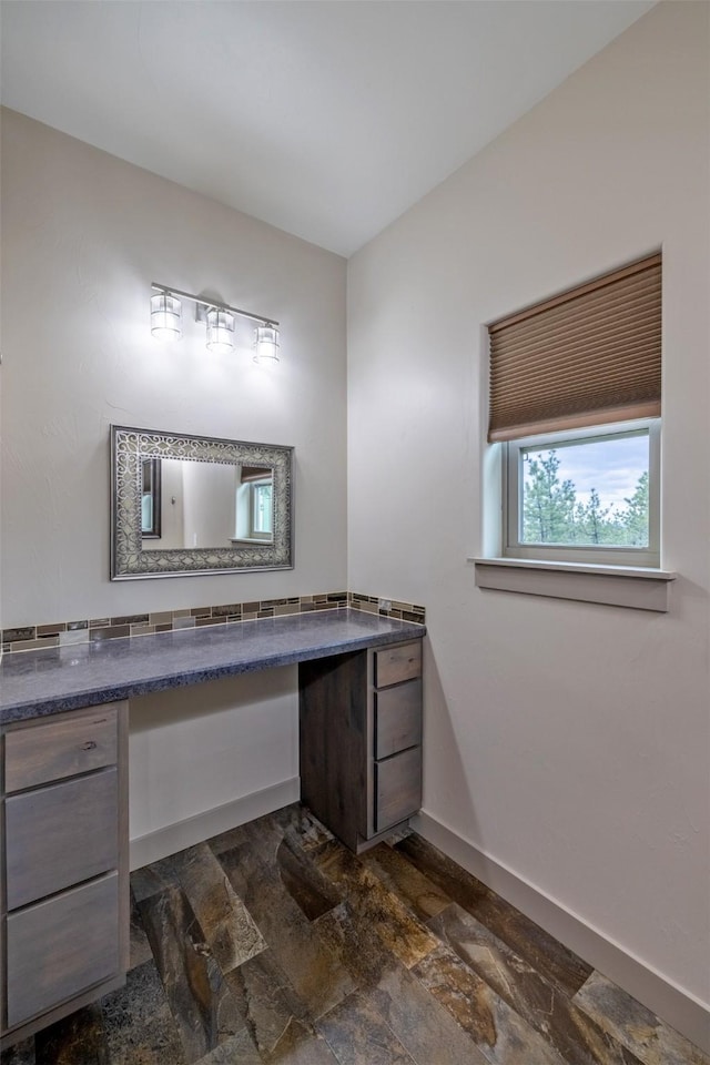 3525 Overland Rd, Helena, MT 59602 - bathroom with vanity, stone tile flooring, and baseboards