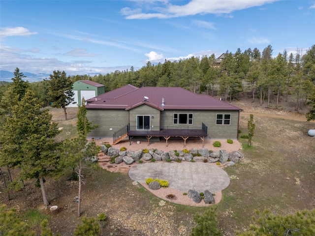 3525 Overland Rd, Helena, MT 59602 - rear view of house with a deck and metal roof