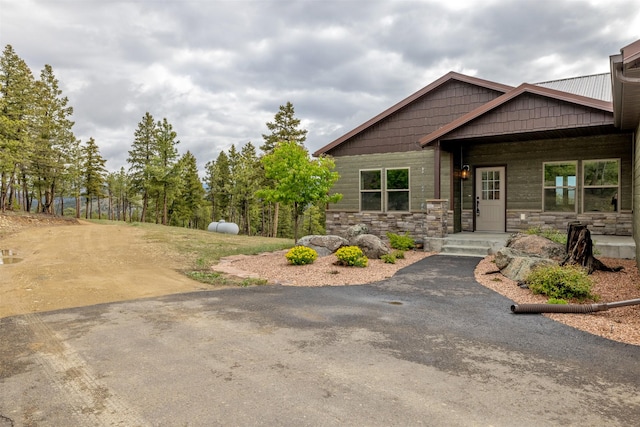 3525 Overland Rd, Helena, MT 59602 - craftsman-style house featuring stone siding and asphalt driveway