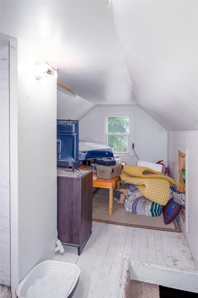 945 3rd Ave W, Kalispell, MT 59901 - bedroom with wood-type flooring and lofted ceiling