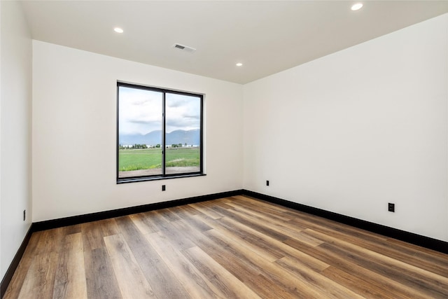 34544 Eagle Crest Dr, Polson, MT 59860 - spare room with wood finished floors, recessed lighting, and baseboards
