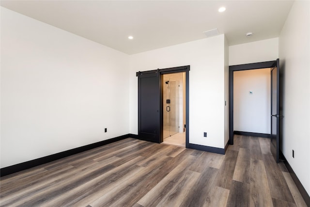 34544 Eagle Crest Dr, Polson, MT 59860 - unfurnished bedroom featuring dark wood finished floors, baseboards, and recessed lighting