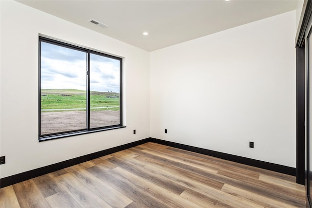 34544 Eagle Crest Dr, Polson, MT 59860 - unfurnished room with recessed lighting, wood finished floors, and baseboards