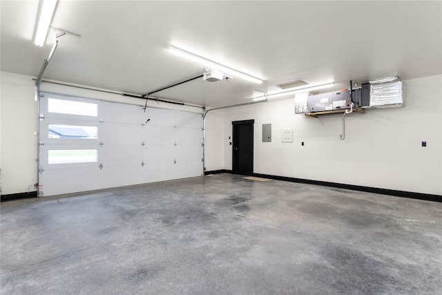 34544 Eagle Crest Dr, Polson, MT 59860 - garage with a garage door opener, baseboards, and electric panel