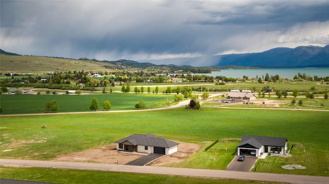 34544 Eagle Crest Dr, Polson, MT 59860 - view of community with a water and mountain view and a garage