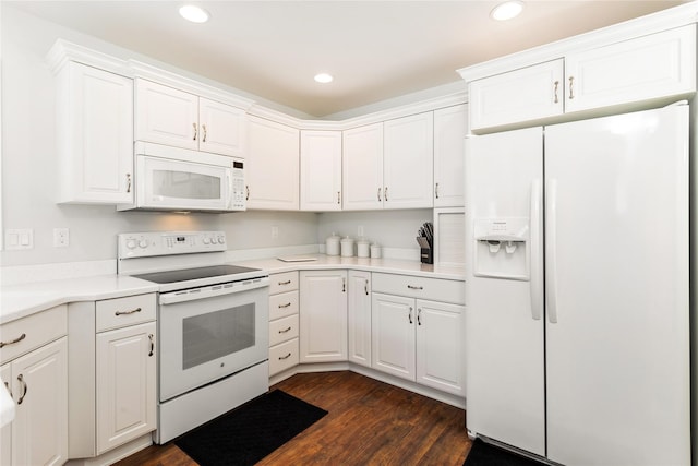 173 Empire Loop, Kalispell, MT 59901 - kitchen with white appliances, dark wood finished floors, white cabinets, recessed lighting, and light countertops