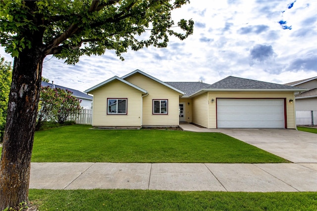 173 Empire Loop, Kalispell, MT 59901 - ranch-style house featuring a garage, concrete driveway, and a shingled roof